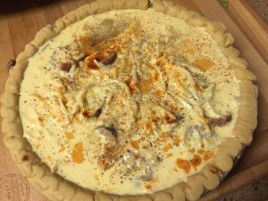 Egg mixture in store bought crust waiting to be baked.