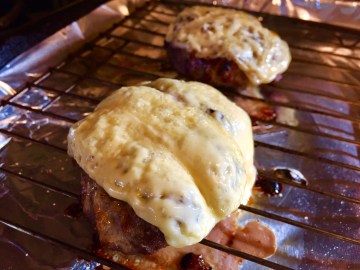 Burgers with melted cheese.